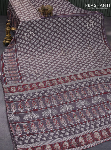 Muslin silk saree grey shade with allover dabu prints & pita work and ajrakh printed border