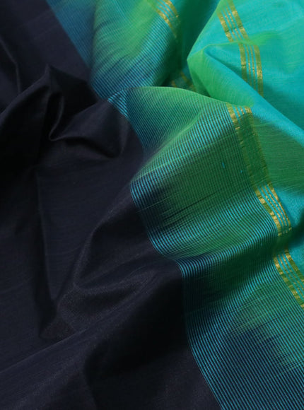 Silk cotton saree black and dual shade of teal bluish green with plain body and zari woven border