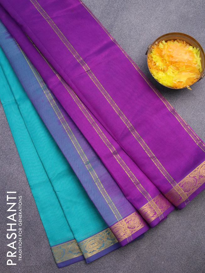 Silk cotton saree teal blue and violet with plain body and floral & paisley zari woven border