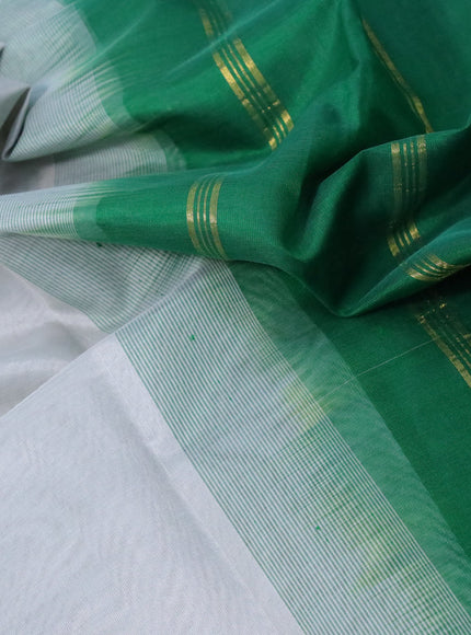 Silk cotton saree grey and green with plain body and zari woven border