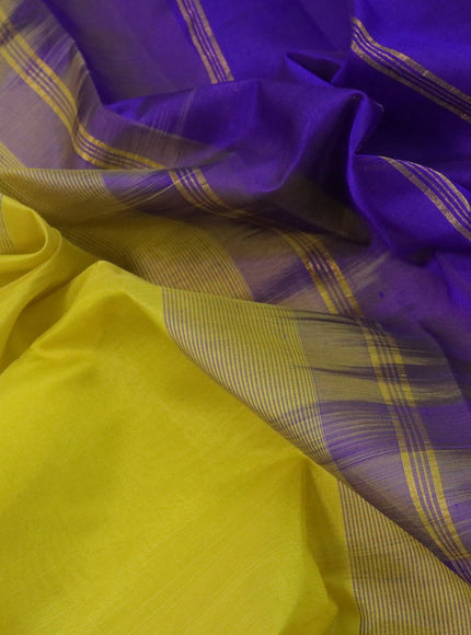 Silk cotton saree lime yellow and violet with plain body and paisley zari woven border