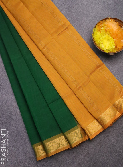 Silk cotton saree green and mustard yellow with plain body and paisley zari woven border