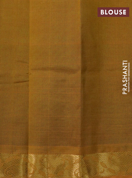 Silk cotton saree green and mustard yellow with plain body and paisley zari woven border