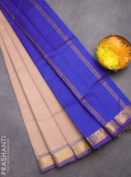 Silk cotton saree sandal and blue with plain body and paisley zari woven border