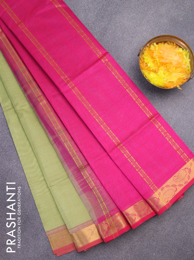 Silk cotton saree pastel green and pink with plain body and paisley zari woven border