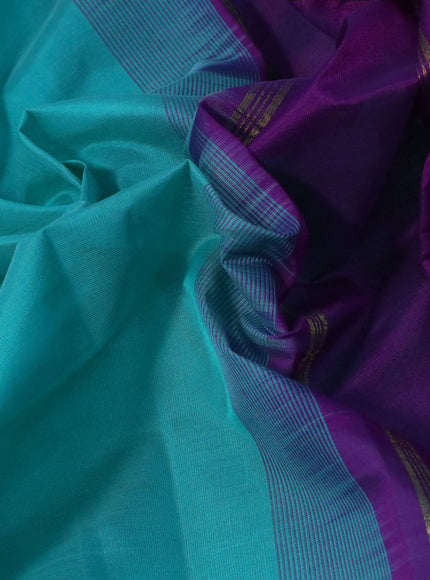 Silk cotton saree teal blue and violet with plain body and annam zari woven border