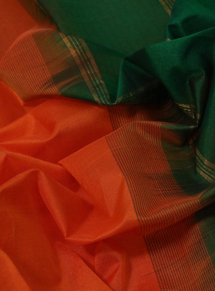 Silk cotton saree orange and green with plain body and annam zari woven border