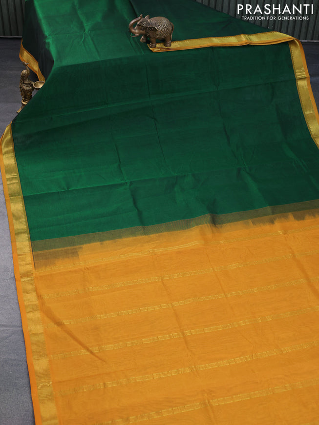 Silk cotton saree dark green and mustard yellow with plain body and zari woven border