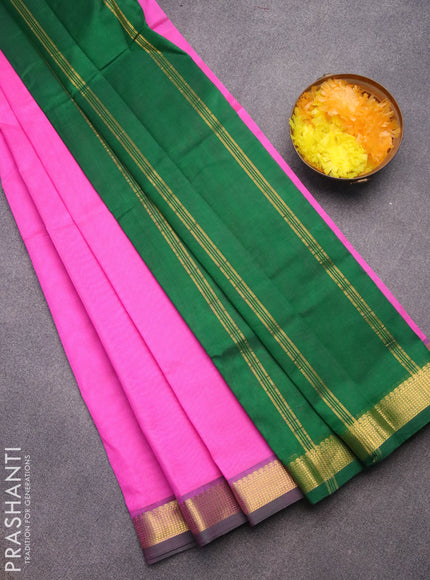 Silk cotton saree candy pink and green with plain body and zari woven border