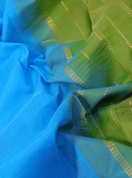 Silk cotton saree cs blue and light green with plain body and zari woven border