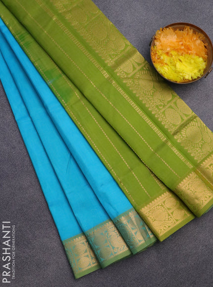 Silk cotton saree teal blue and light green with plain body and zari woven border