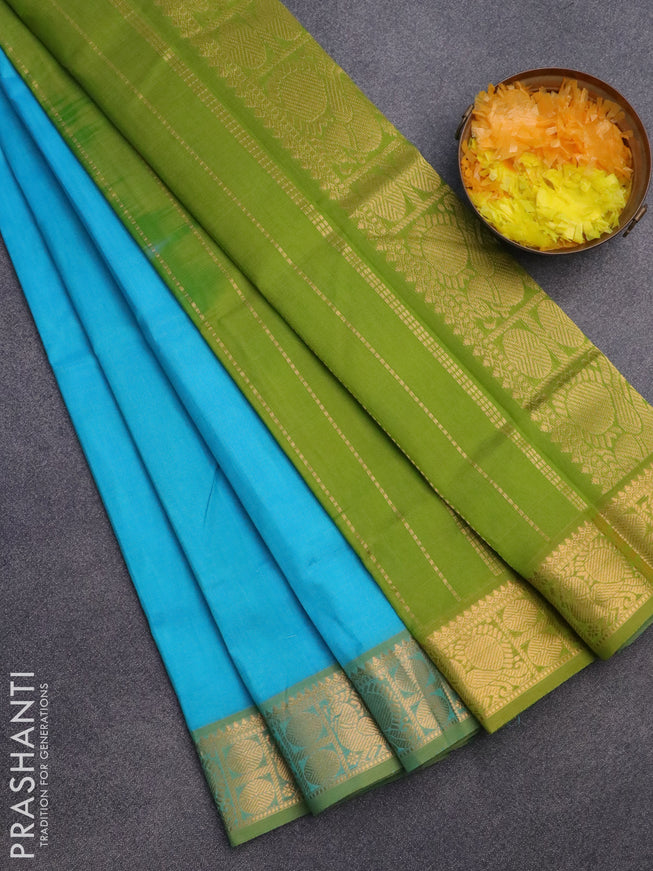 Silk cotton saree teal blue and light green with plain body and zari woven border