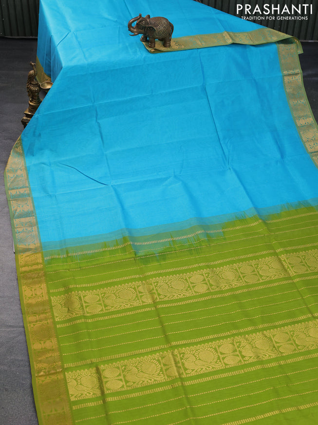 Silk cotton saree teal blue and light green with plain body and zari woven border