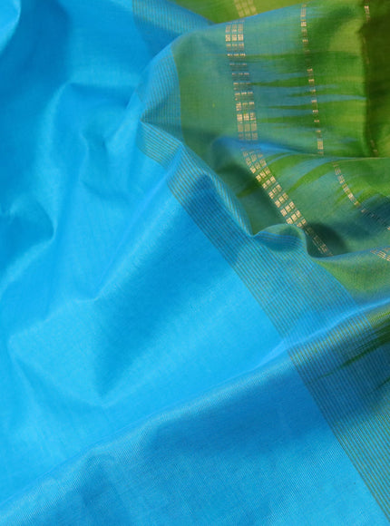 Silk cotton saree teal blue and light green with plain body and zari woven border