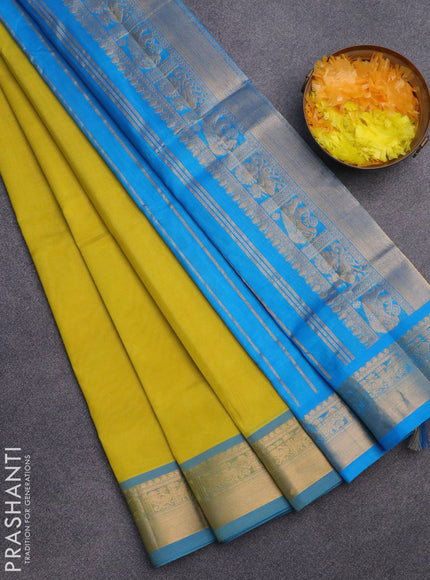 Silk cotton saree lime yellow and light blue with plain body and zari woven border