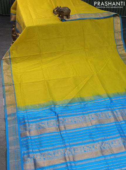 Silk cotton saree lime yellow and light blue with plain body and zari woven border