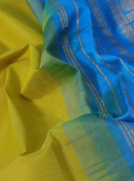 Silk cotton saree lime yellow and light blue with plain body and zari woven border