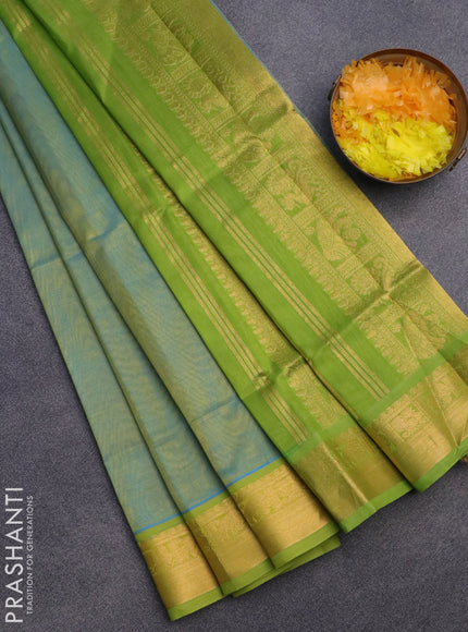 Silk cotton saree dual shade of teal blue and light green with plain body and zari woven border