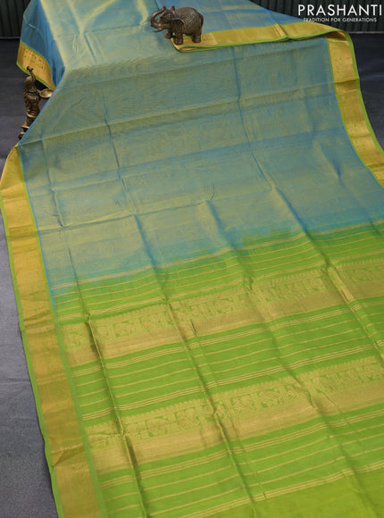 Silk cotton saree dual shade of teal blue and light green with plain body and zari woven border