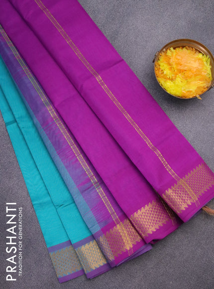 Silk cotton saree teal blue and purple with plain body and zari woven border