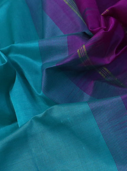 Silk cotton saree teal blue and purple with plain body and zari woven border