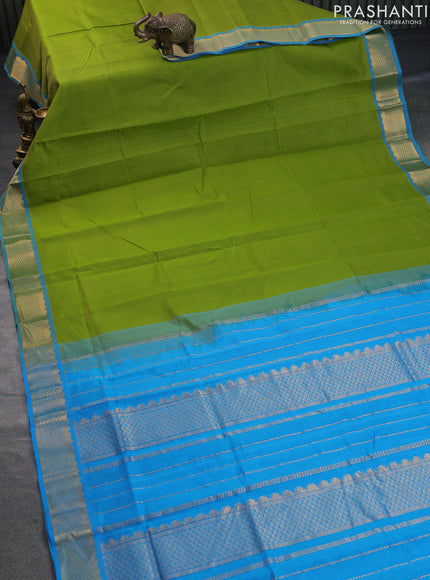 Silk cotton saree light green and cs blue with plain body and zari woven border