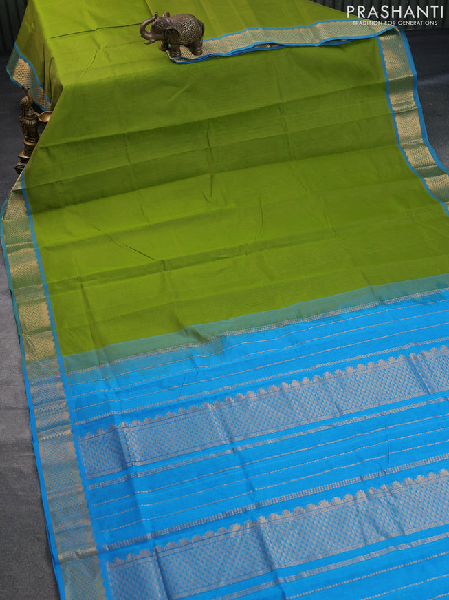 Silk cotton saree light green and cs blue with plain body and zari woven border