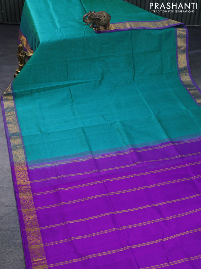 Silk cotton saree teal blue and purple with plain body and peacock zari woven border