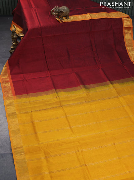 Silk cotton saree maroon and mustard yellow with plain body and peacock zari woven border