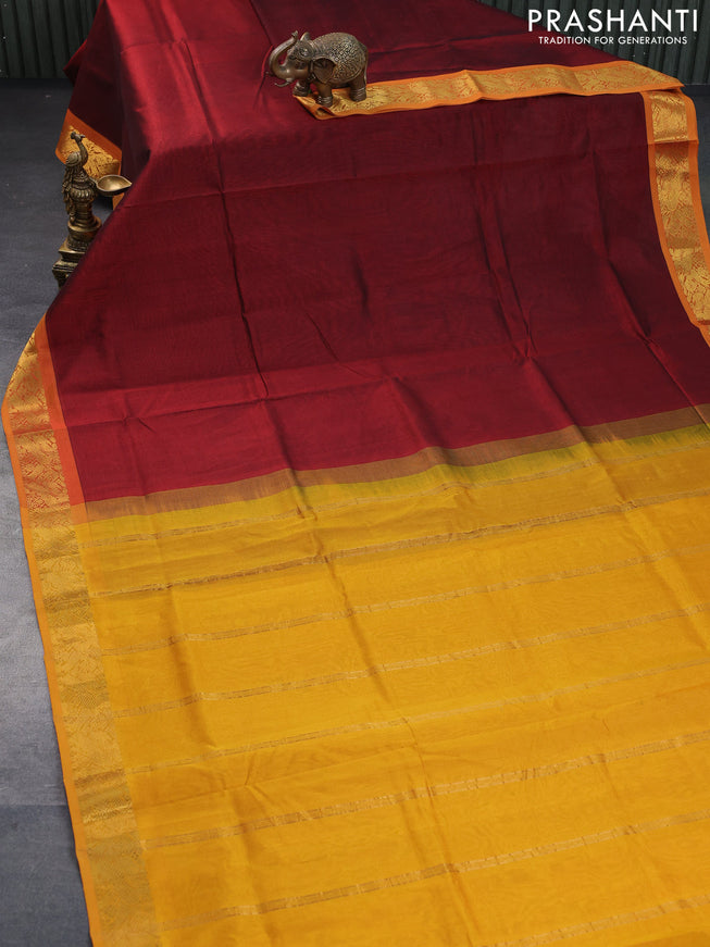 Silk cotton saree maroon and mustard yellow with plain body and peacock zari woven border