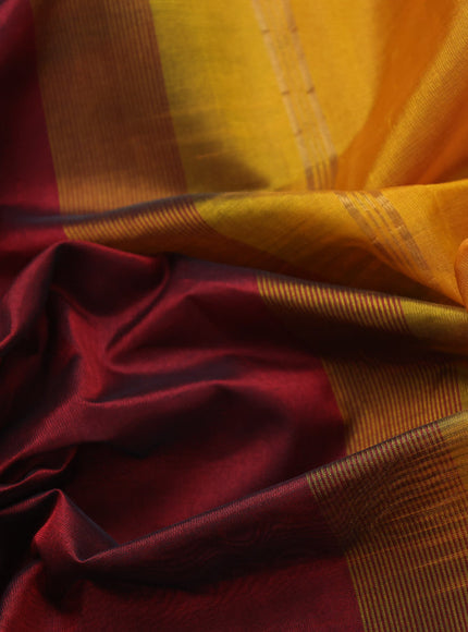 Silk cotton saree maroon and mustard yellow with plain body and peacock zari woven border