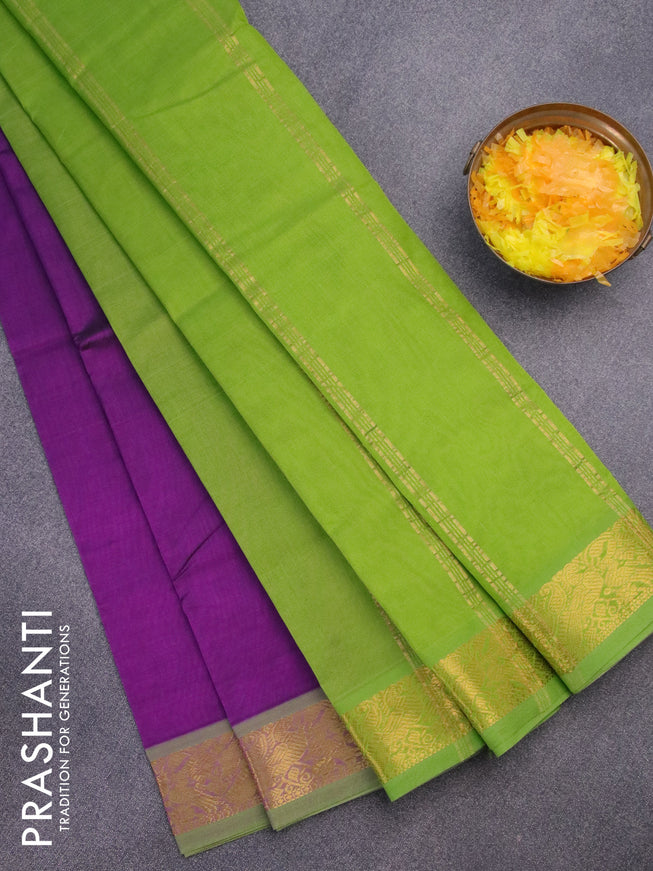 Silk cotton saree purple and light green with plain body and peacock zari woven border