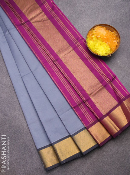 Silk cotton saree grey and purple with plain body and zari woven border