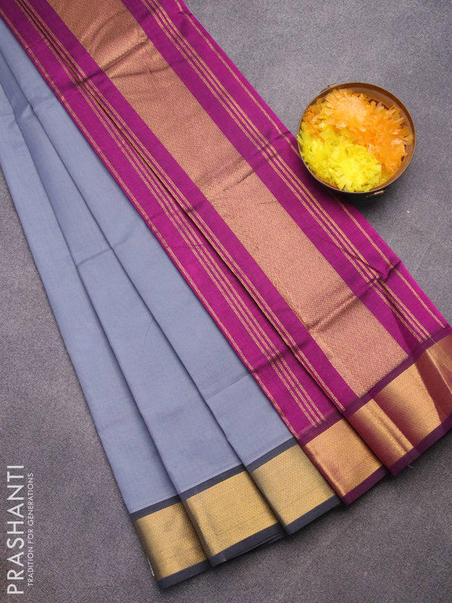 Silk cotton saree grey and purple with plain body and zari woven border