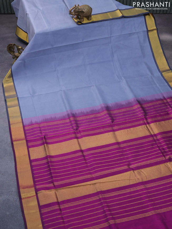 Silk cotton saree grey and purple with plain body and zari woven border