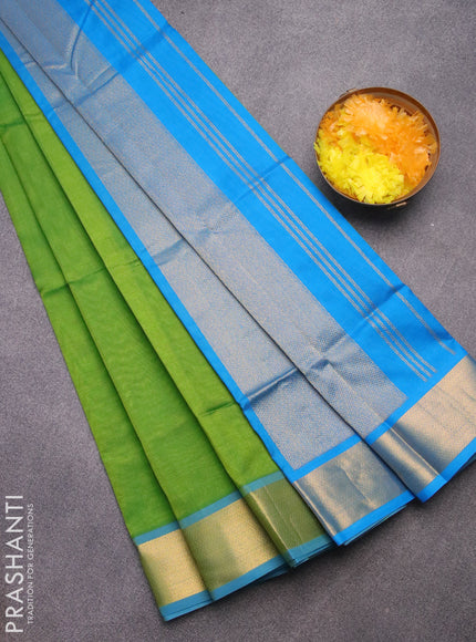 Silk cotton saree light green and cs blue with plain body and zari woven border