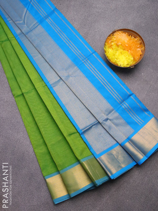 Silk cotton saree light green and cs blue with plain body and zari woven border