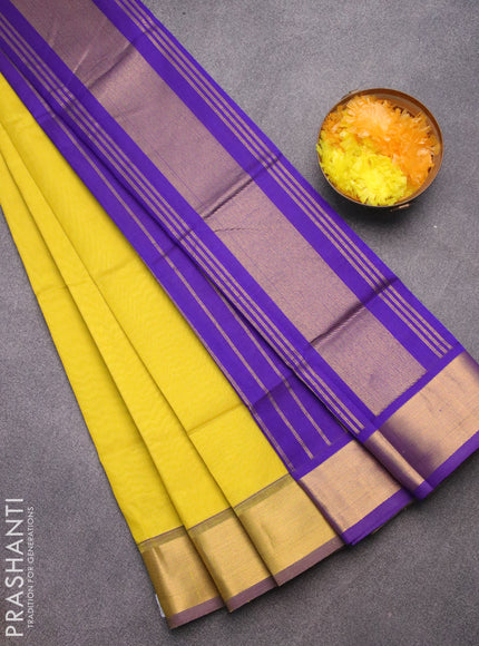 Silk cotton saree lime yellow and blue with plain body and zari woven border