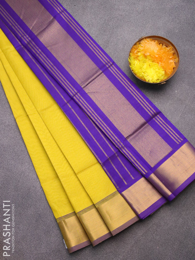 Silk cotton saree lime yellow and blue with plain body and zari woven border