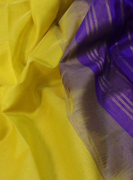 Silk cotton saree lime yellow and blue with plain body and zari woven border