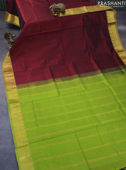 Silk cotton saree deep maroon and light green with plain body and paisley zari woven border