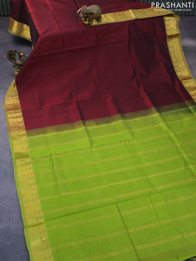 Silk cotton saree deep maroon and light green with plain body and paisley zari woven border