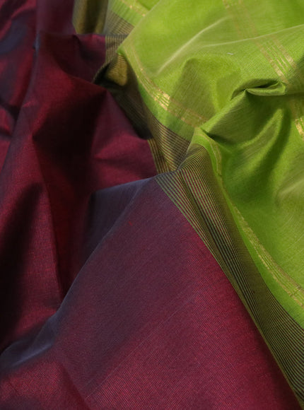 Silk cotton saree deep maroon and light green with plain body and paisley zari woven border