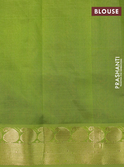 Silk cotton saree deep maroon and light green with plain body and paisley zari woven border