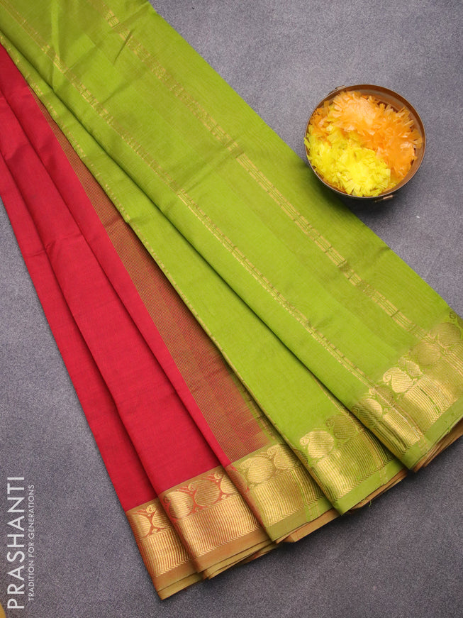 Silk cotton saree maroon and light green with plain body and paisley zari woven border