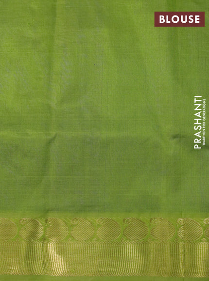 Silk cotton saree blue and light green with plain body and paisley zari woven border