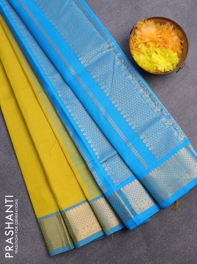 Silk cotton saree lime yellow and light blue with plain body and zari woven border