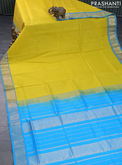 Silk cotton saree lime yellow and light blue with plain body and zari woven border