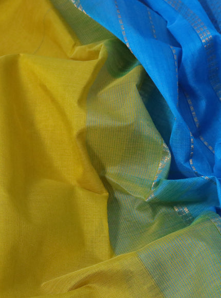 Silk cotton saree lime yellow and light blue with plain body and zari woven border