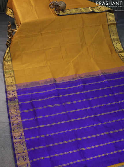 Silk cotton saree mustard shade and blue with plain body and zari woven border